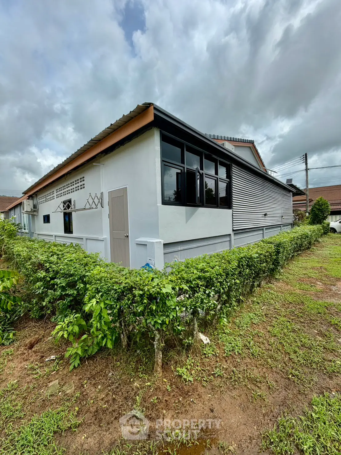 Charming single-story home with lush garden and modern exterior design, perfect for family living.