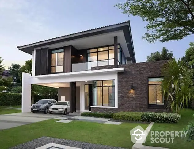 Modern two-story home with elegant design, featuring a mix of brick and wood finishes, large windows, and a lush green lawn.