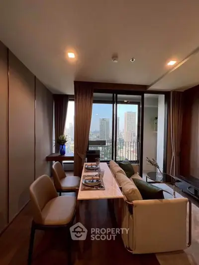 Stylish living room with city view, modern furniture, and elegant decor in a high-rise apartment.