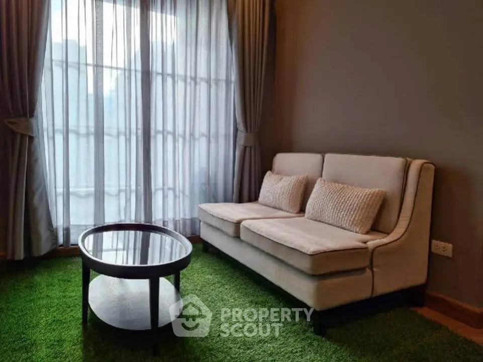 Cozy living room with plush sofa and stylish coffee table on green carpet