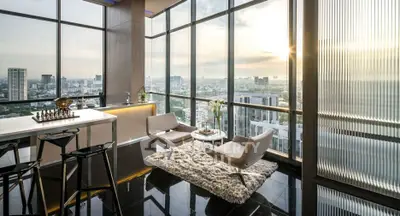 Luxurious high-rise apartment with panoramic city views and modern interior design.