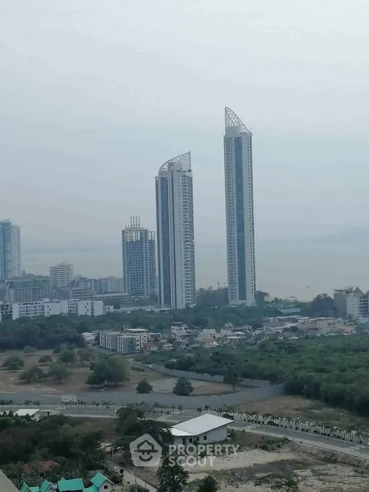 Stunning high-rise buildings with panoramic city and sea views, ideal for luxury living.