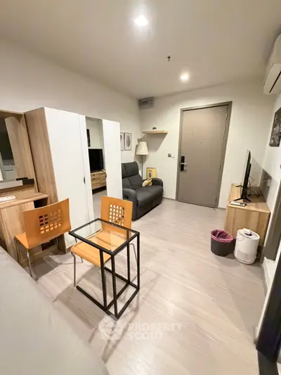 Modern living room with sleek furniture and neutral tones, perfect for cozy urban living.