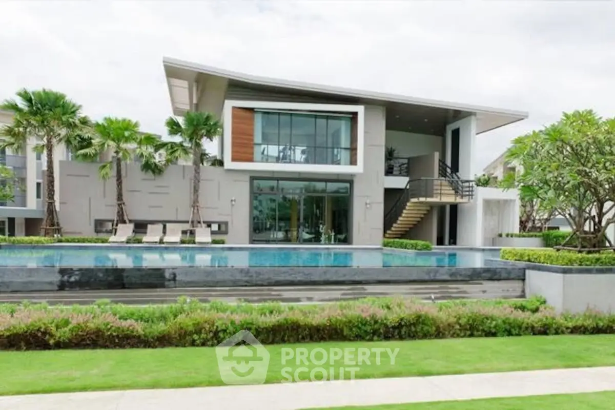 Luxurious modern villa with pool and lush garden, perfect for upscale living.