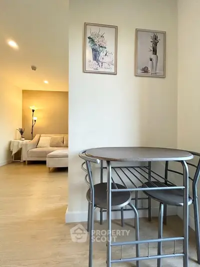 Charming living room with cozy seating and elegant decor, perfect for relaxation and entertaining.
