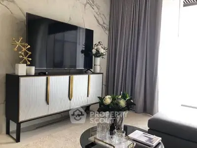 Modern living room with stylish TV console and elegant decor