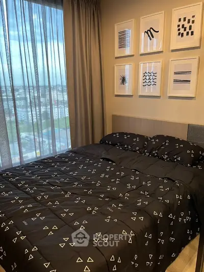 Stylish bedroom with modern decor and city view, perfect for urban living