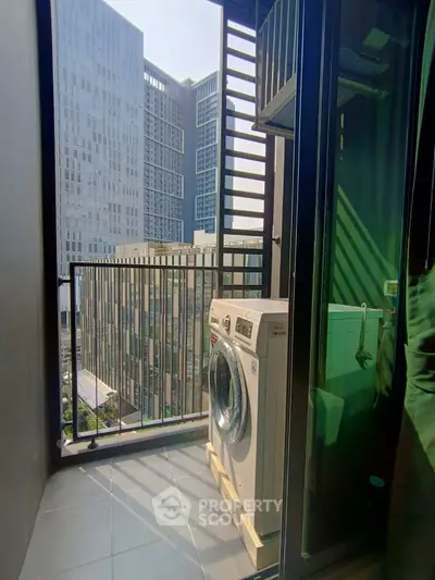Modern apartment balcony with washing machine and city view