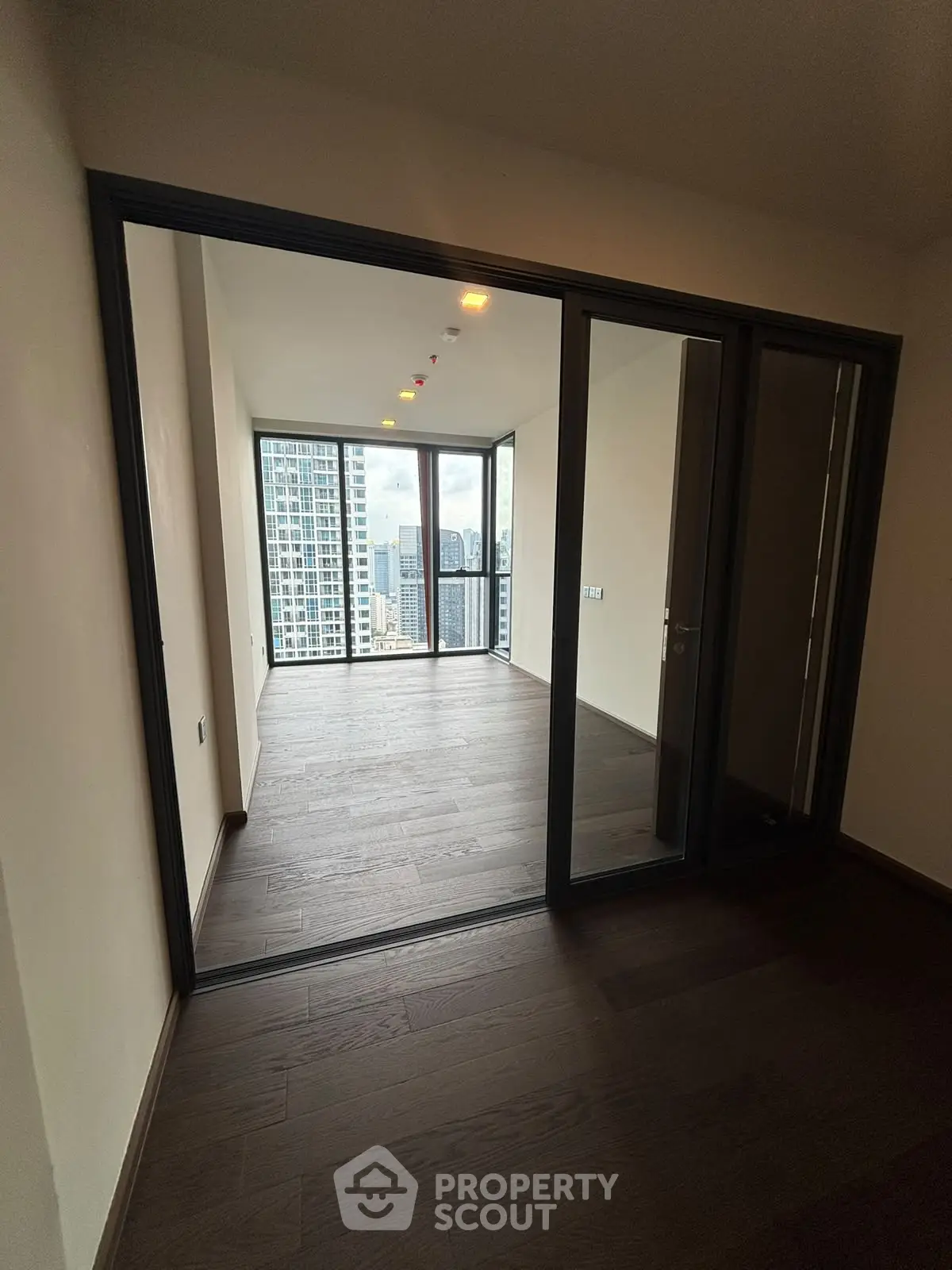 Spacious corner unit with floor-to-ceiling windows offering stunning city views.