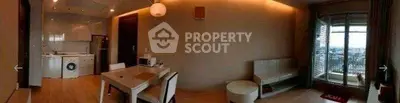 Modern apartment interior with open kitchen and balcony view