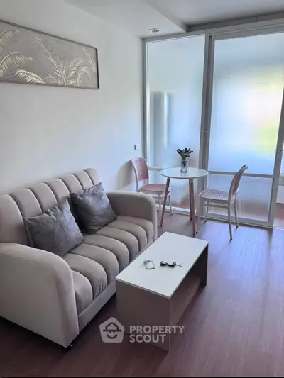 Chic modern living room with cozy sofa and stylish dining area, perfect for urban living.