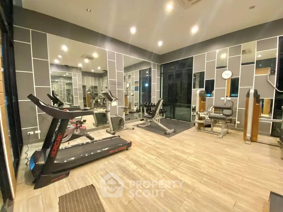 Modern gym with state-of-the-art equipment and stylish interior design.