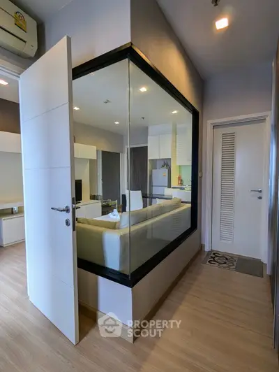 Modern apartment interior with glass partition and sleek design