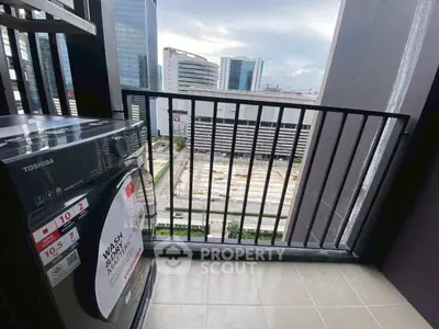 Modern balcony with washing machine and city view in high-rise apartment