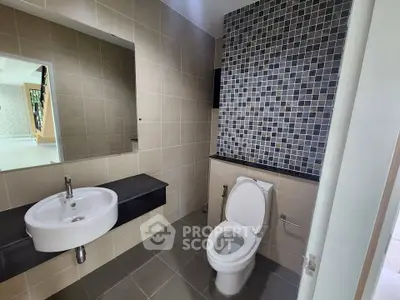 Modern bathroom with sleek design and stylish tile accents