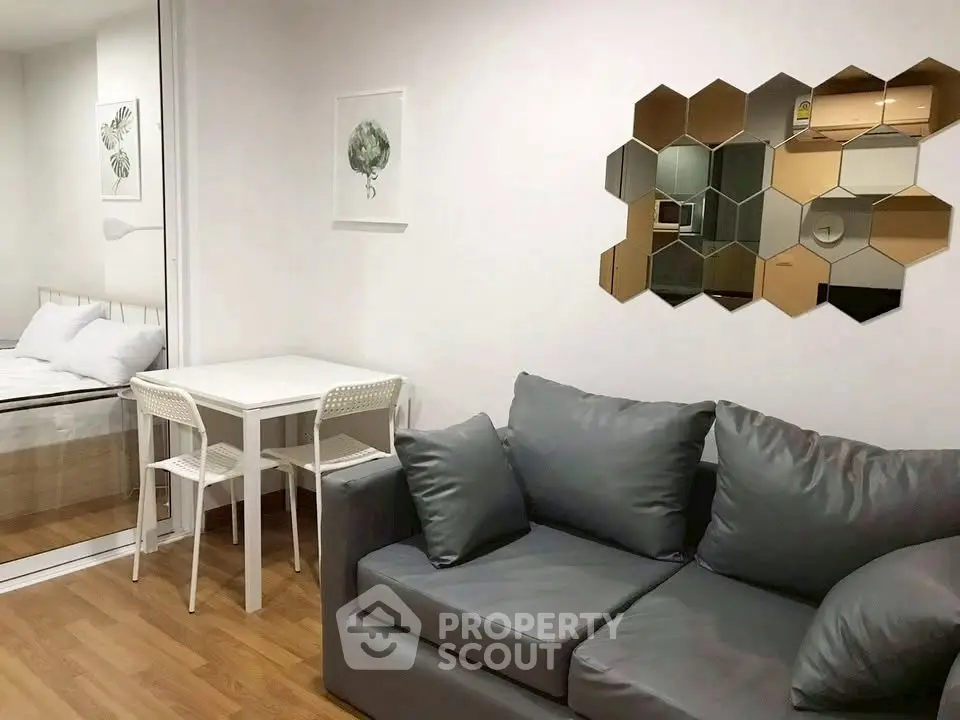 Modern living room with stylish decor and cozy seating in a contemporary apartment.