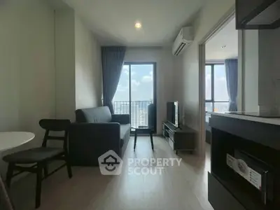 Modern living room with balcony view in high-rise apartment