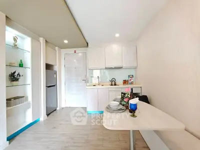 Modern kitchen with sleek design and dining area in a stylish apartment