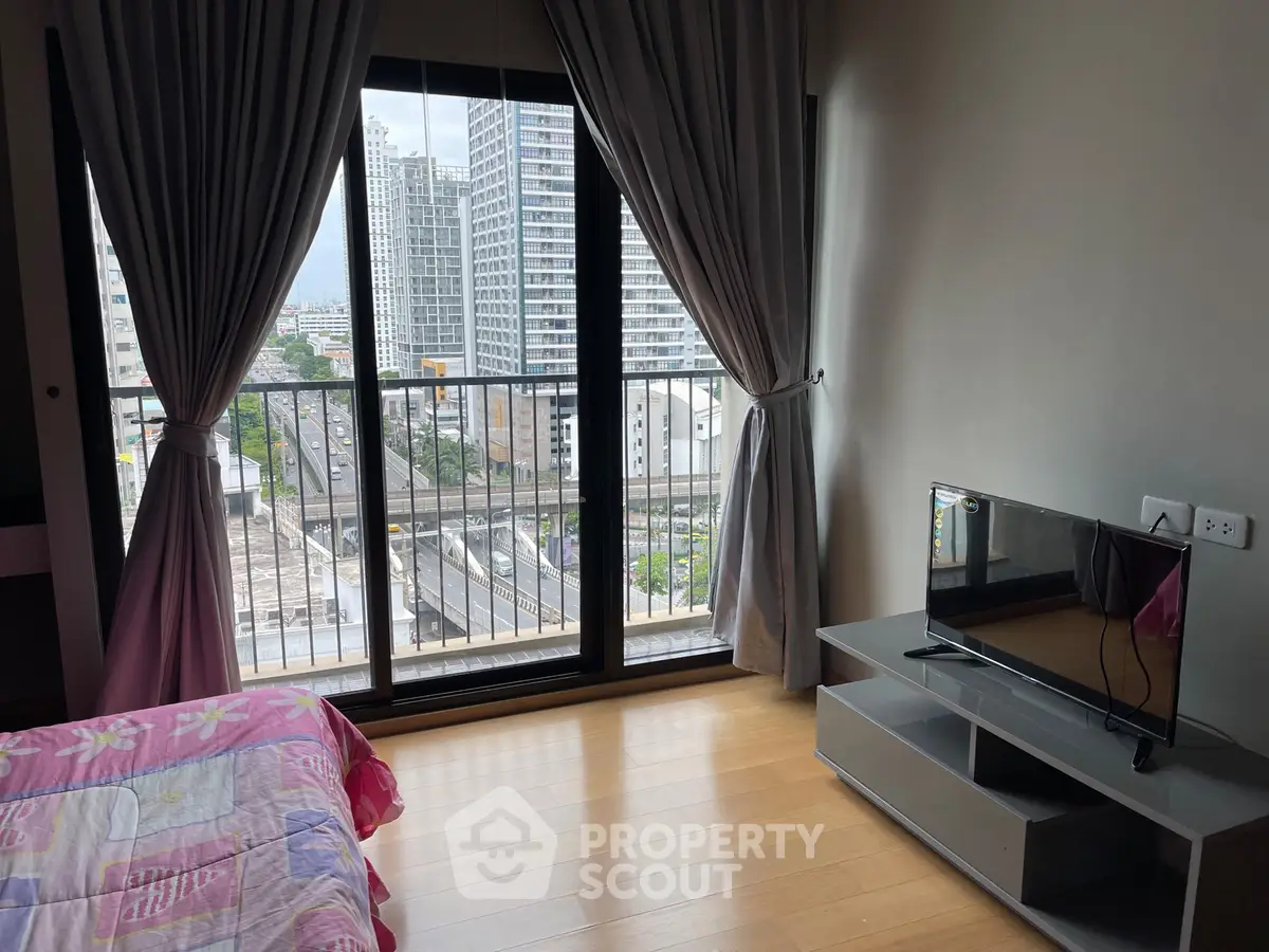 Modern bedroom with balcony view in high-rise apartment