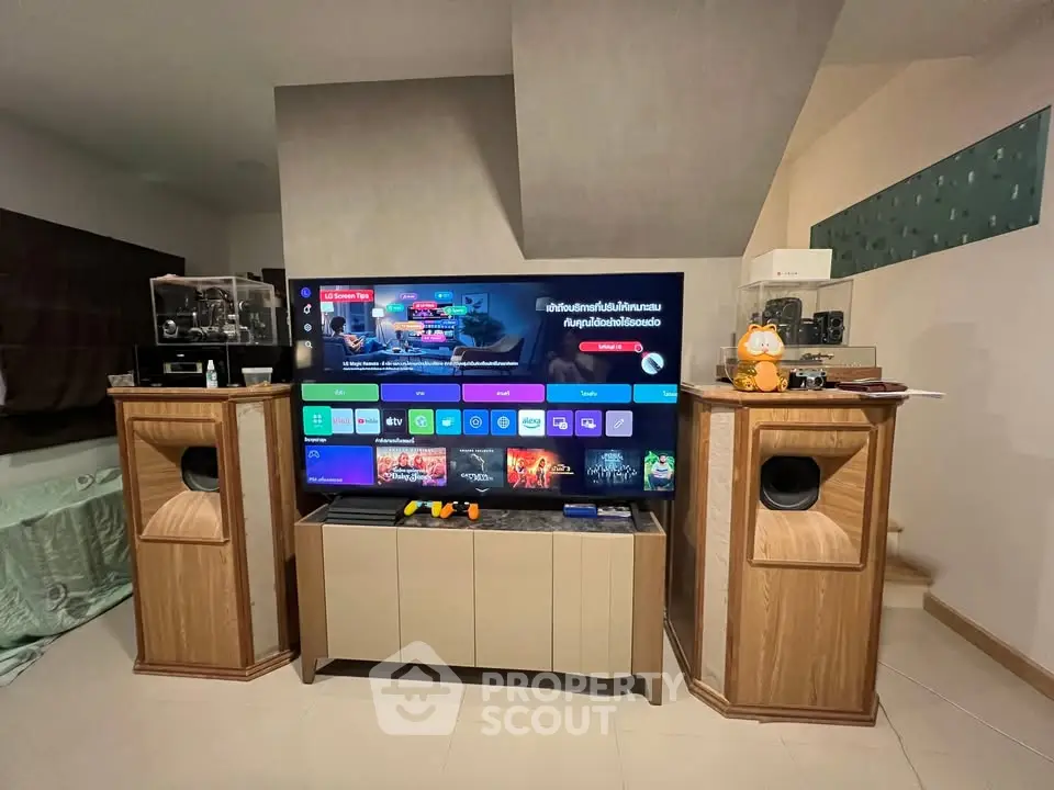Stylish living room with modern entertainment center and large TV setup