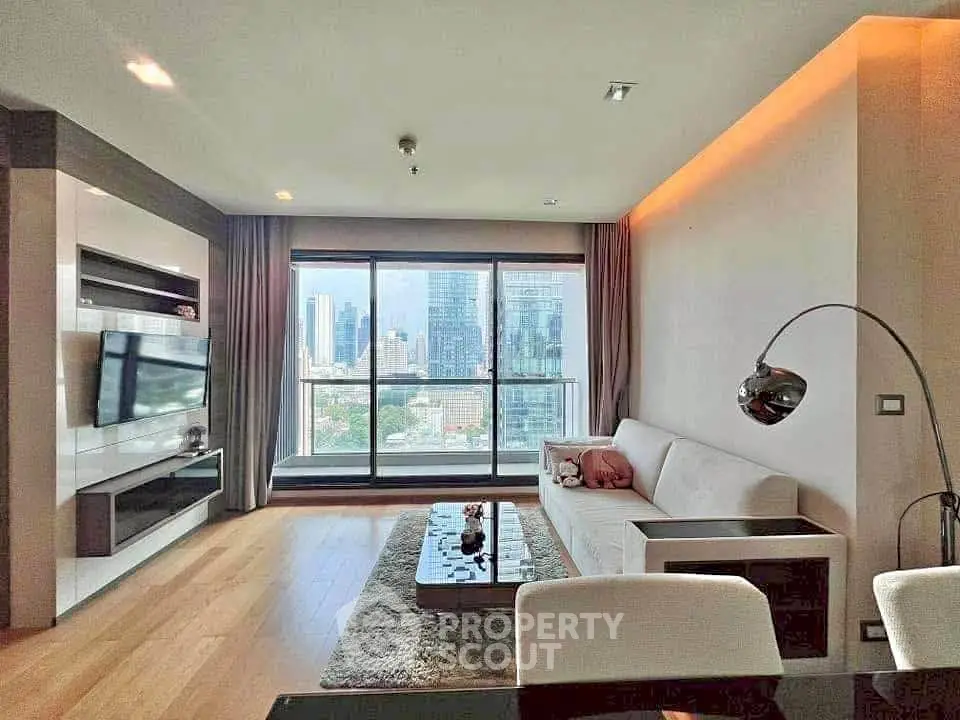 Modern living room with city view, sleek furniture, and ambient lighting.