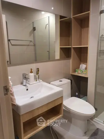 Modern bathroom with sleek fixtures and ample storage space