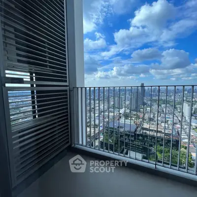 Stunning high-rise balcony with panoramic city view and modern railing design.