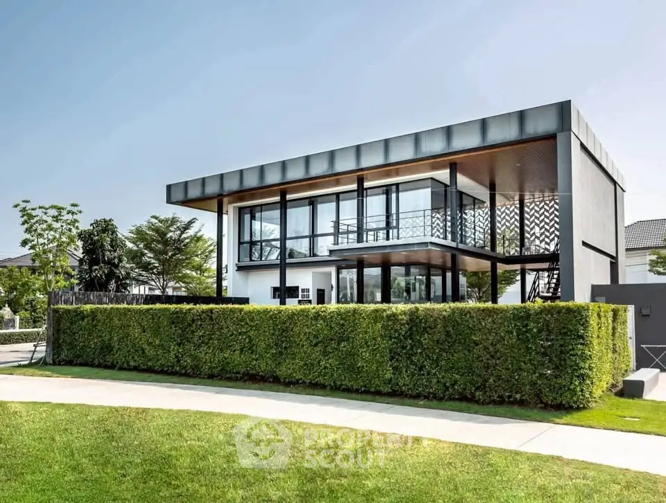 Modern architectural home with sleek design and lush greenery, perfect for contemporary living.