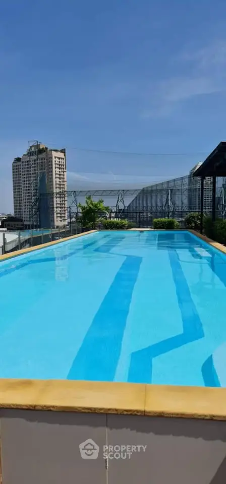 Stunning rooftop pool with cityscape views, perfect for relaxation and leisure.