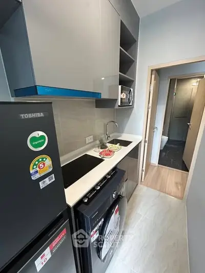 Modern compact kitchen with sleek appliances and efficient layout