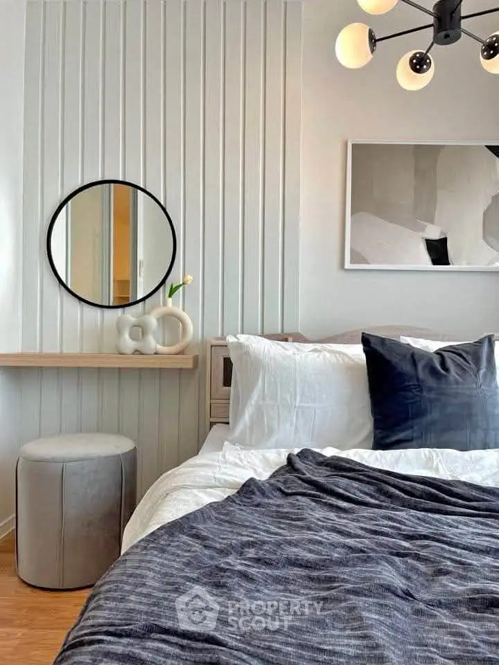 Stylish bedroom with modern decor and cozy bedding