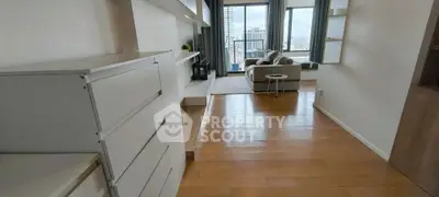 Spacious living room with modern decor and city view balcony