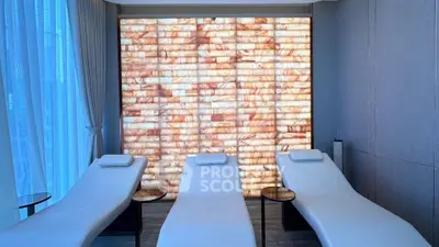 Luxurious spa room with elegant lounge chairs and ambient lighting for ultimate relaxation.