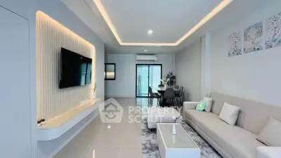 Modern living room with sleek design, ambient lighting, and stylish furniture in a contemporary apartment.