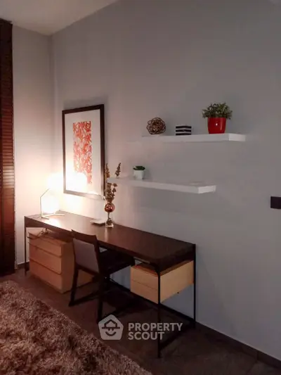 Modern study room with sleek desk, stylish decor, and ambient lighting for a perfect work-from-home setup.