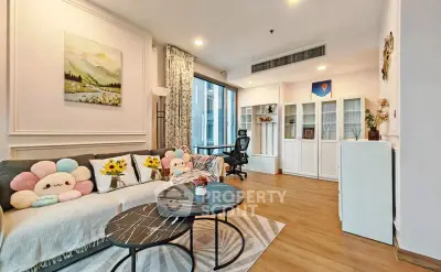 Charming living room with cozy decor and modern furnishings, featuring a stylish seating area and ample natural light.
