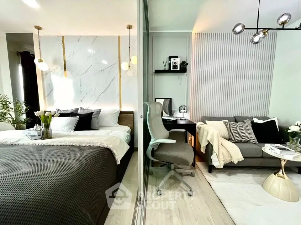Modern studio apartment with stylish bedroom and cozy living area, featuring elegant decor and contemporary lighting.