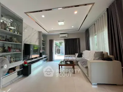 Spacious modern living room with large windows and elegant decor