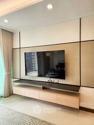 Modern living room with sleek TV unit and elegant curtains, perfect for stylish urban living.