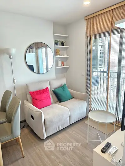 Cozy living room with modern decor and balcony view
