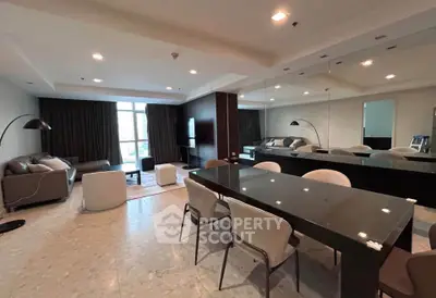 Spacious modern living room with elegant dining area and large windows