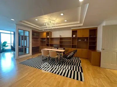 Spacious dining area with modern lighting and wooden flooring