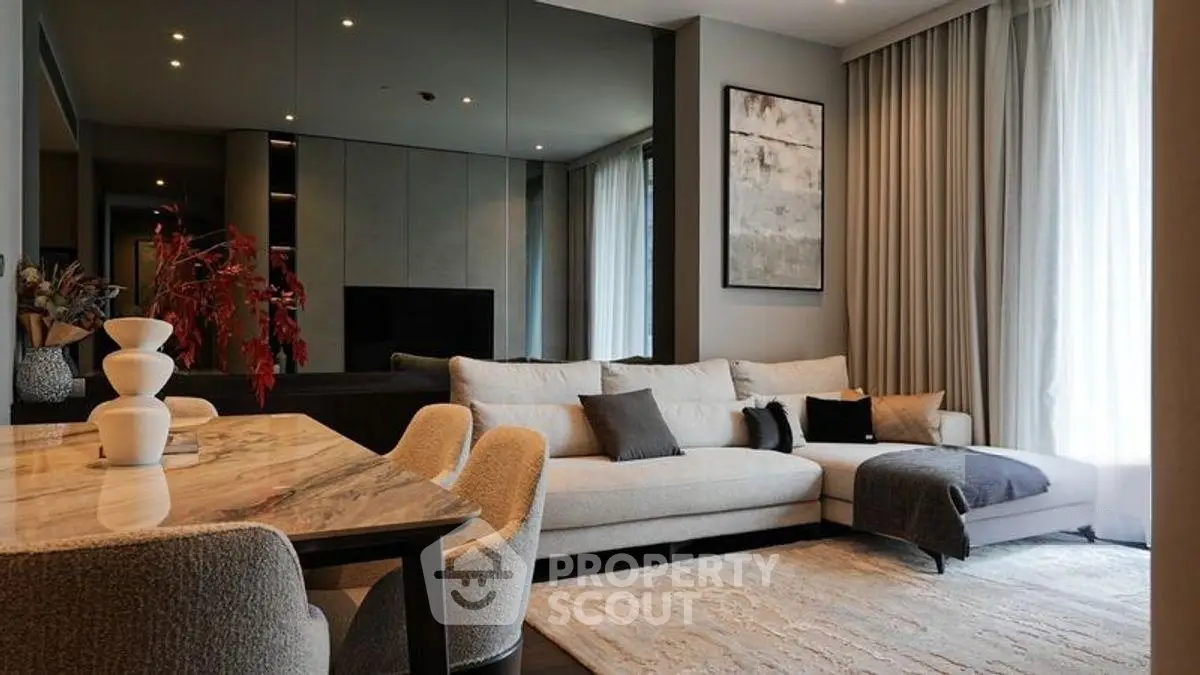 Luxurious modern living room with elegant decor and cozy seating area.