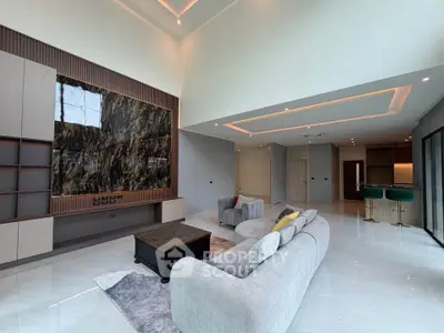 Luxurious modern living room with high ceilings and elegant decor
