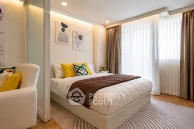 Elegant bedroom with modern decor and natural light