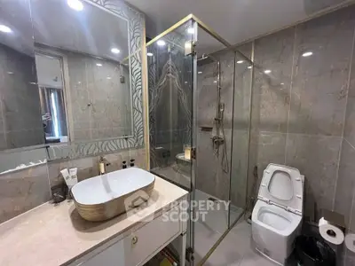 Luxurious modern bathroom with glass shower and elegant sink design