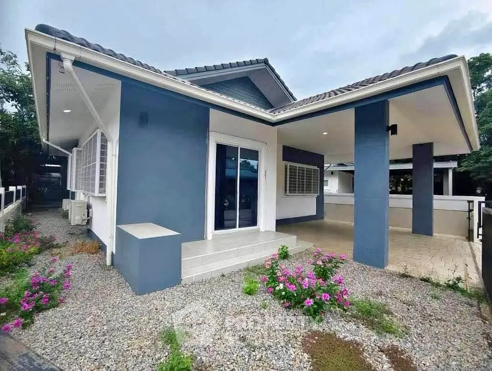 Charming single-story home with modern exterior and landscaped garden, perfect for family living.