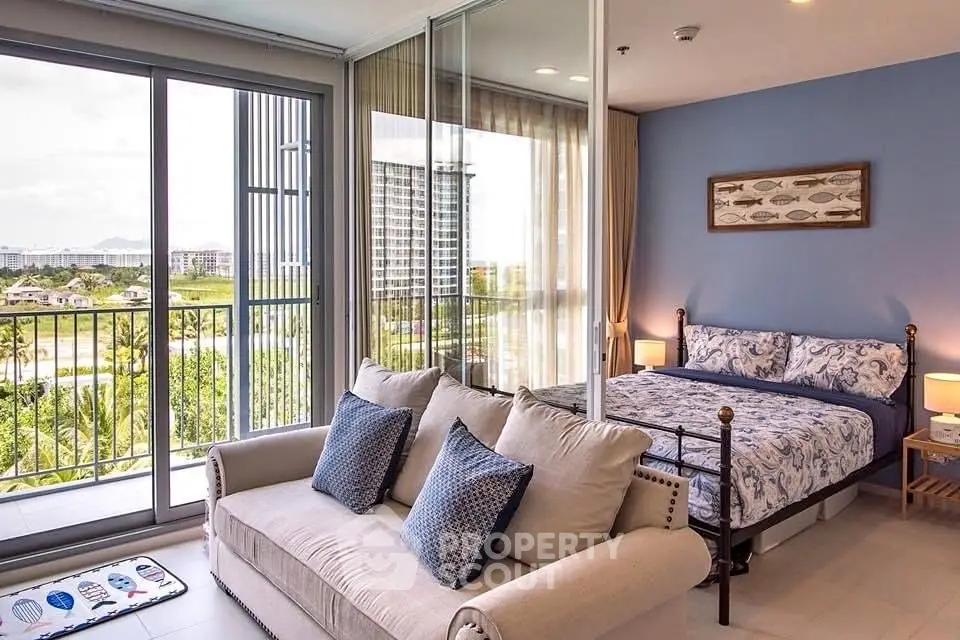 Spacious bedroom with balcony offering stunning views in modern apartment