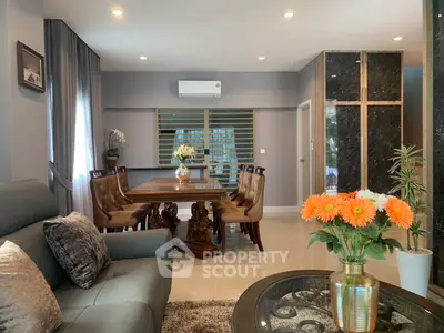 Elegant living room with stylish dining area and modern decor