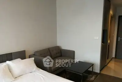 Modern bedroom with cozy sofa and sleek design